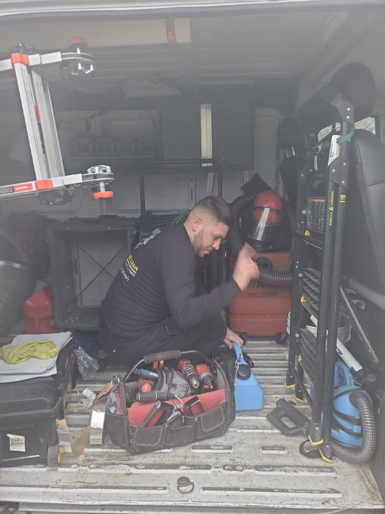 Bee cleaning technician is cleaning air ducts and equipment (22)