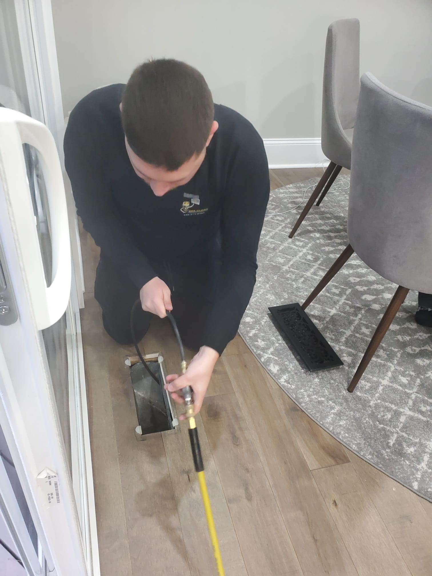 Bee cleaning technician is cleaning air ducts and equipment